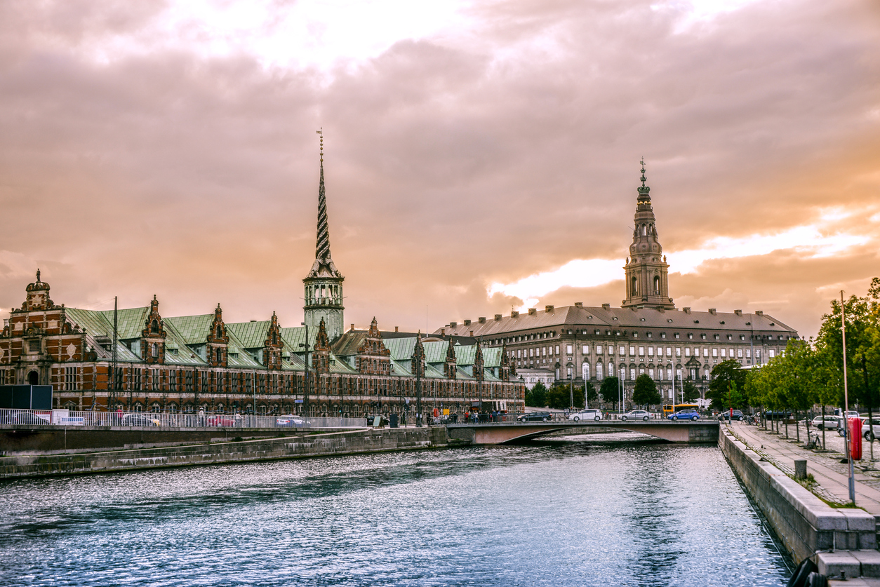 Beautiful Canal in Copenhagen and view of Stock Exchange Building at Sunset